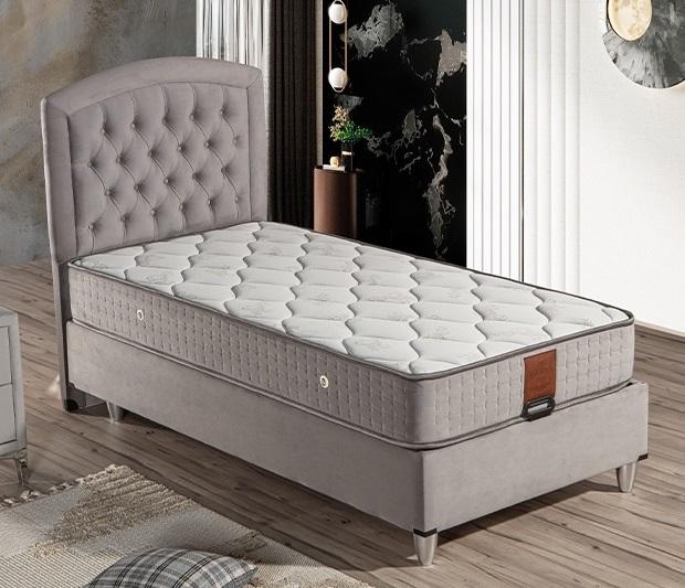 Elegantes graues Bett mit Matratze aus Textil und Edelstahl